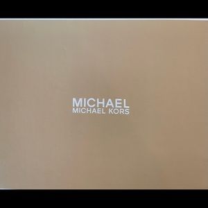 Michael Kors Kaylee Wedges, black in color, leather strapping that buckles.